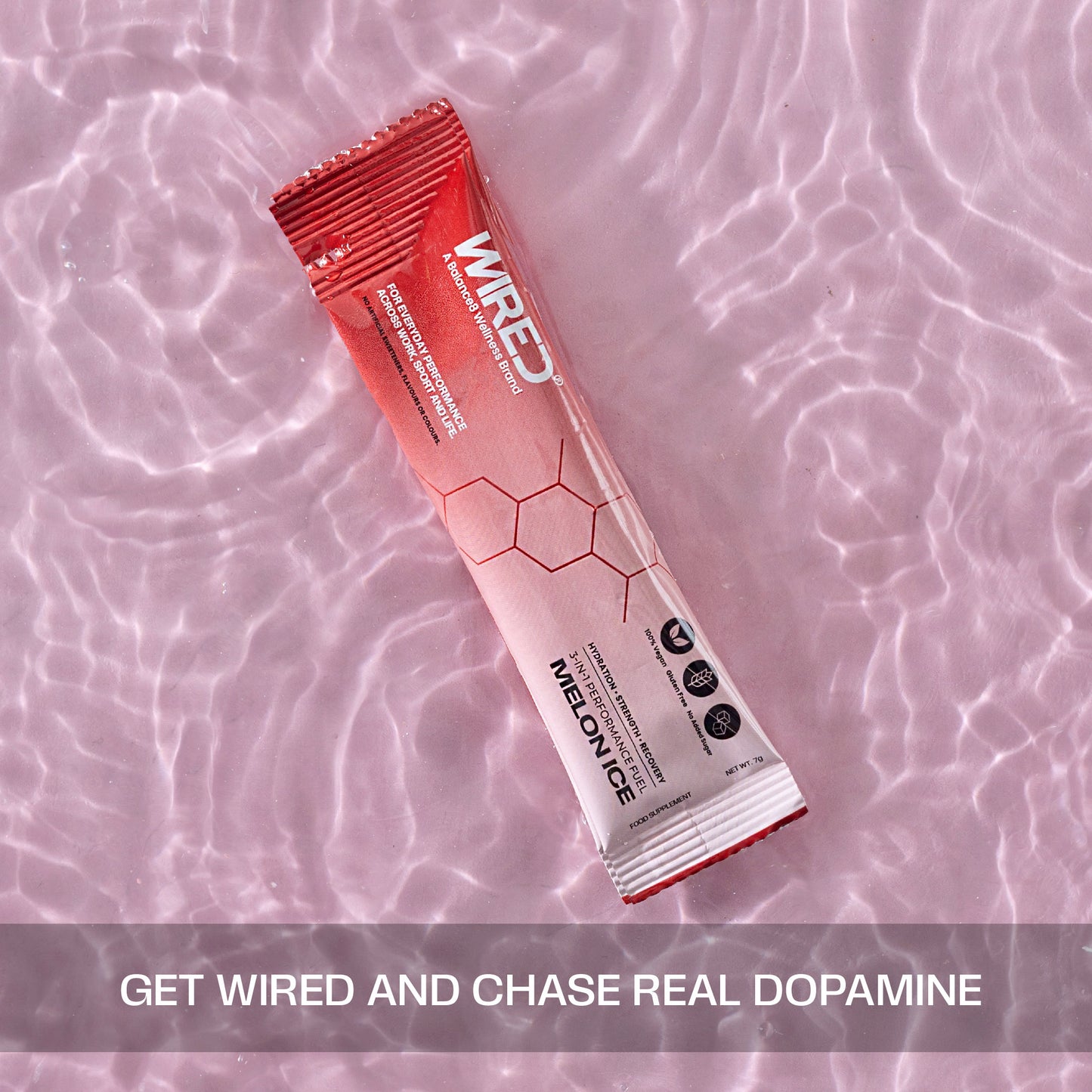 WIRED Melon Ice sachet floating in pink water – get WIRED and chase real dopamine | Balance8 Wellness